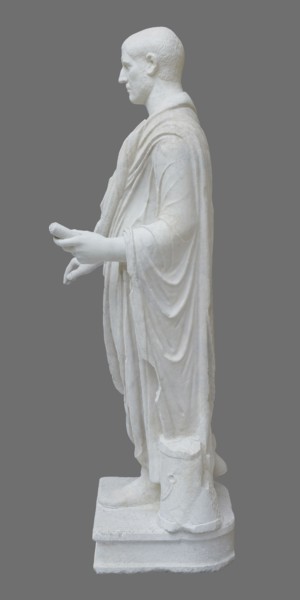 Roman statue, unknown Roman workshop. Figure of a striding man dressed in a tunic and toga. The