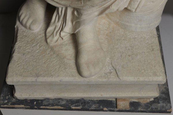 Roman statue, unknown Roman workshop. Figure of a striding man dressed in a tunic and toga. The