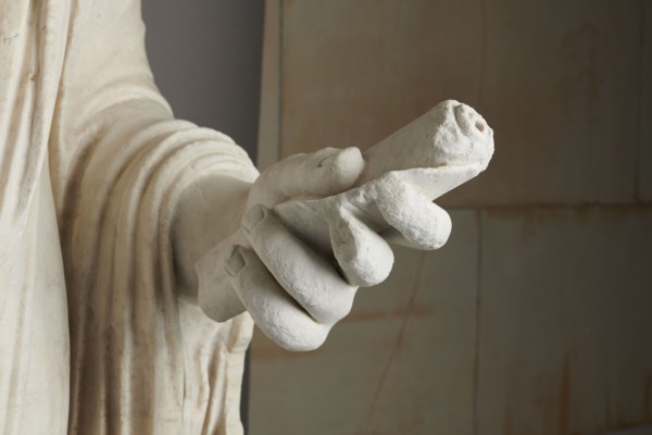 Roman statue, unknown Roman workshop. Figure of a striding man dressed in a tunic and toga. The