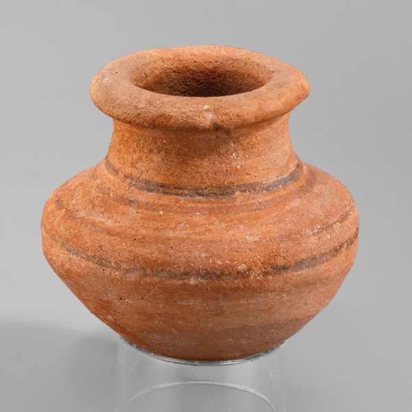 Vessel, A small wheel-made clay vessel with an almost hemispherical belly that transitions halfway