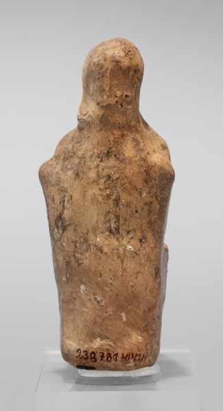 Figurine of a seated woman. Figurine of a woman sitting on a throne with her hands placed on her