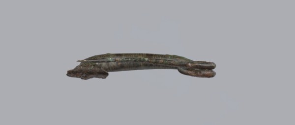 Arched fibula. One-piece fibula with an arched bow made of a round bar, decorated with groups of