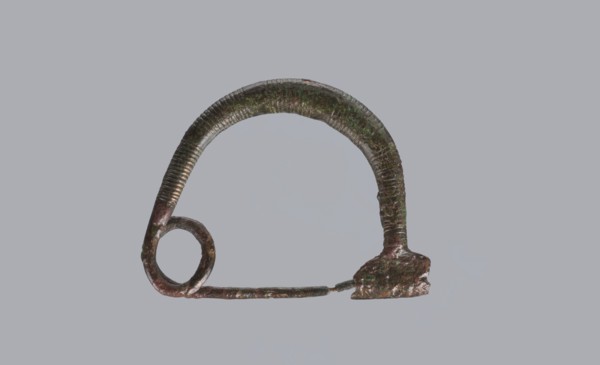 Arched fibula, one-piece ad arco semplice fibula with an arched bow made of a round bronze bar,