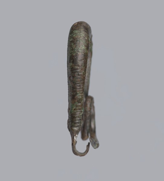 Arched fibula, one-piece fibula with an arched bow made of a round bar, decorated with groups of