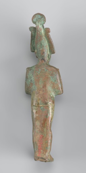 Figurine of Osiris depicted as a mummy-like standing figure wrapped in a shroud. The arms