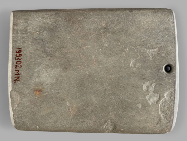 Rectangular paddle, flat with a hole at one of the shorter edges; possibly a whetstone.