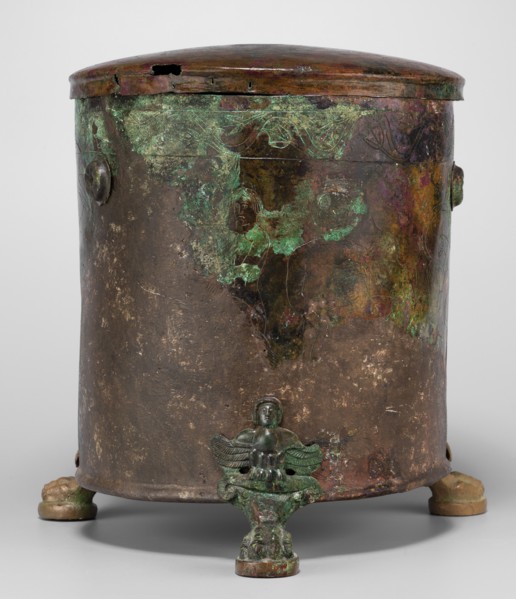 Cista container decorated with a depiction of the Dioscuri and Athena. Cylindrical sheet-metal