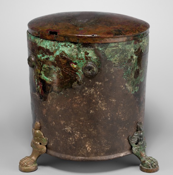 Cista container decorated with a depiction of the Dioscuri and Athena. Cylindrical vessel made of