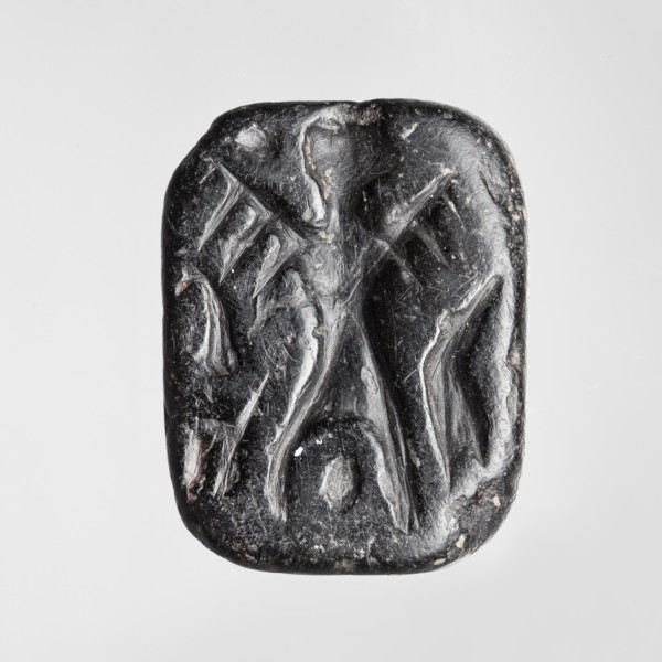 Rectangular stamp seal with a handle in the form of a protruding ridge along the axis of the seal