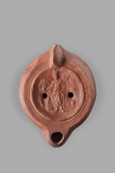 Lamp decorated with a representation of the goddess Roma with an eagle and a palm branch; at the