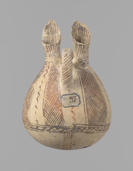 Jug, unknown Cypriot workshop. White painted ware jug with a spherical bottom, a bulging