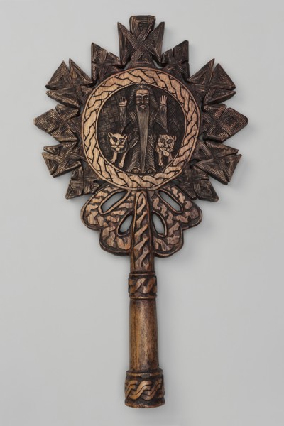 Processional cross, Ethiopian workshop. In the center of the cross, in the tondo, a standing man is