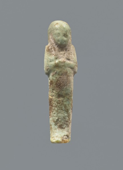 Ushabti, mummy-shaped figurine; funerary gift; hoes. Hands folded on the chest, uncrossed, right