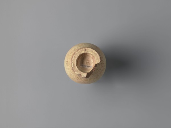 Water vessel qulla. Ovoid with elongated belly; edge of foot protrudes outward. Short, wide neck