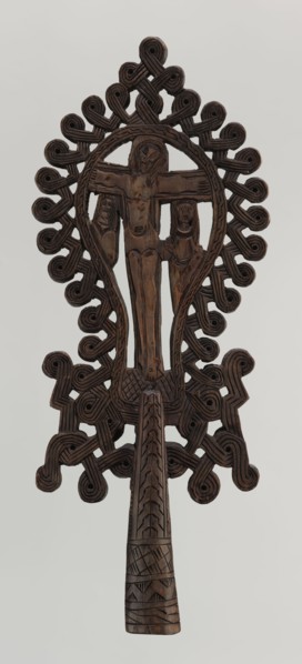 Processional cross, Ethiopian workshop. The pear-shaped frame depicts Christ on the cross with John