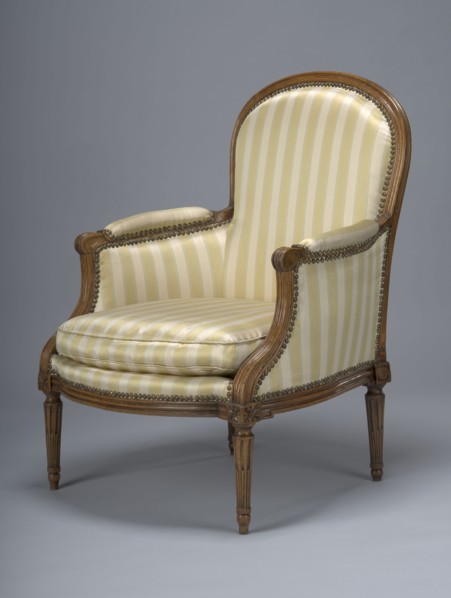 Armchair, covered with striped fabric with a loose cushion; wooden parts waxed. 4th quarter of the