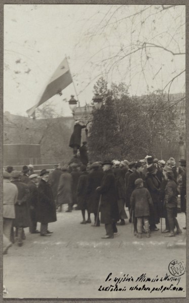Planting a white-and-red flag in front of the Governor's Palace by a student of the University of