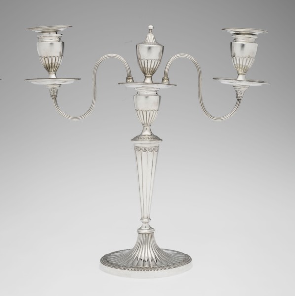 Two-candle candelabrum by Charles Hougham fl. 1769–1793. Two-armed candelabrum on an oval foot,
