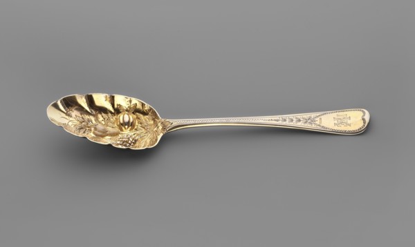 Jam spoon with an ovoid, serrated scoop decorated with a bunch of repoussé fruit; widening handle