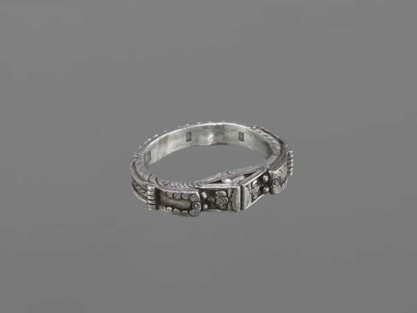Bracelet, maker, scrap metal; 19th century, China/Mongolia; dragon with pearl motif;
