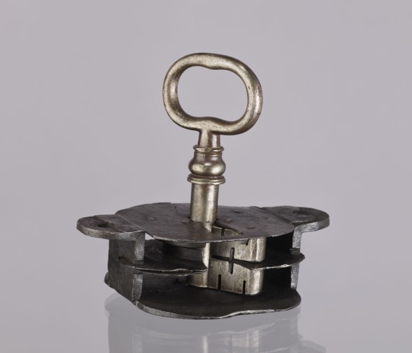 Register lock with key, locksmithing. Register on the bottom plate in the form of an irregular
