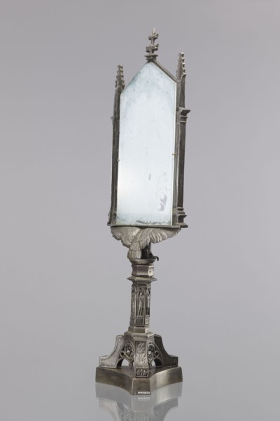 Candle screen. On a three-sided plinth, on a tripod decorated with oak branches, with a hexagonal