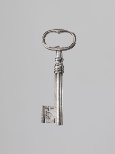 Iron key, locksmithing. Key with a tubular club-shaped shaft, with a feather widened at the end.