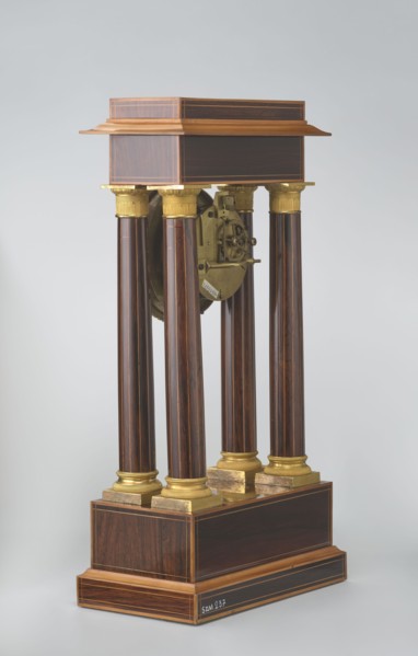 Mantel clock by Alexandre Pertrand fl. ca. 1840. Four-column portico form on a cuboid base and