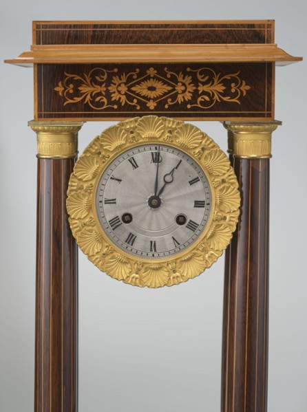 Mantel clock by Alexandre Pertrand fl. ca. 1840. Four-column portico form on a cuboid base and