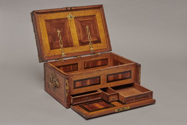 Casket, Repossession noted. Cuboid case inlaid with figural scenes and openwork brass fittings.