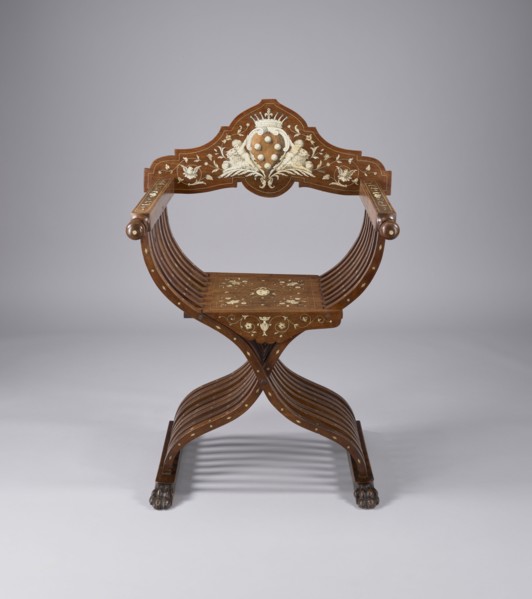 Scissor chair, Scissor armchair made of eight pairs of crossed S-shaped slats, connected at the