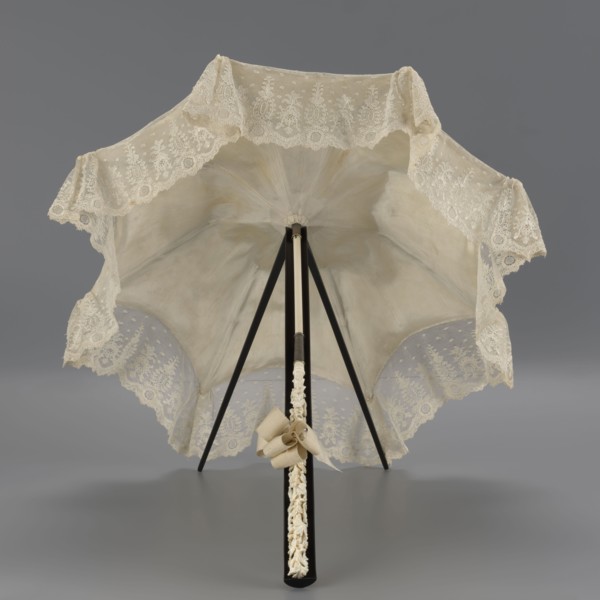 Umbrella, women's umbrella made of white lace. Canopy trimmed with cream silk at the bottom,