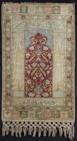 Giordes-type prayer rug, In the central field a red semicircular mihrab arch with offsets; in the