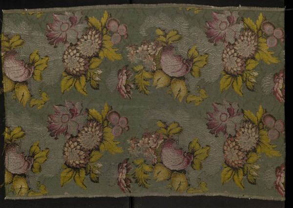 Fragment of patterned silk fabric, 18th century, France. Plant and floral-and-fruit design in a