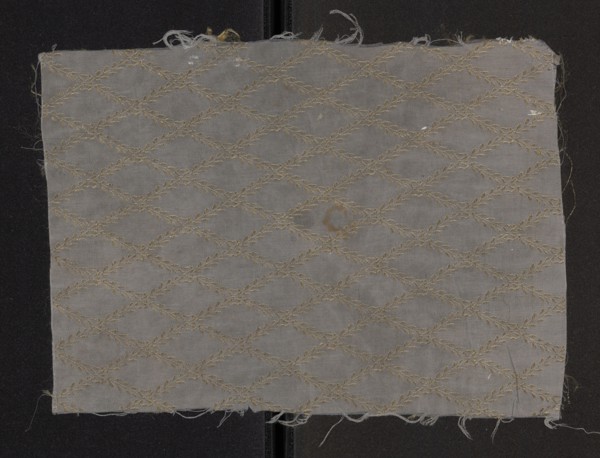 Fabric fragment, silk fragment of patterned fabric with a net composition and preserved pattern.