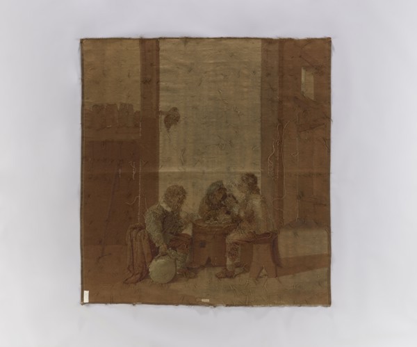 Figural tapestry showing genre scene in an inn. Inside a farm building, perhaps a stable, three men