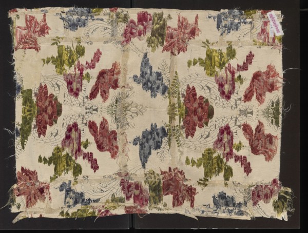 Fabric fragment, silk fabric fragment, patterned with fanciful floral sprigs entwined with silver