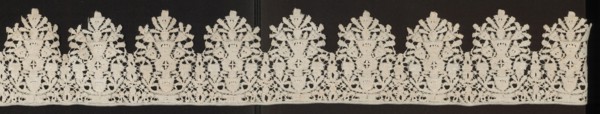 Lace fragment, Floral ornaments; lower edge serrated. In each oval there is a vase of flowers.