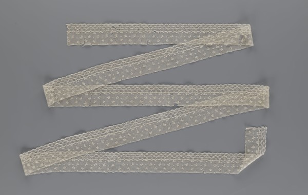 Lace fragment, edge ornament on one side — a net with numerous loops small, round and slightly
