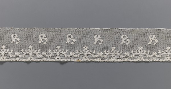 Lace fragment, plant ornaments, Louis XVI style, Malines Mechelen lace. At the lower edge there are