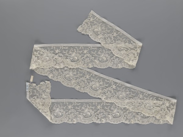 Lace fragment, lace, floral ornaments with rocaille motifs, over-stylized fan-shaped ribbons with