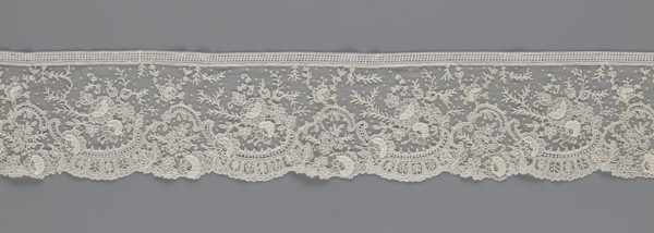 Lace fragment, lace, floral ornaments with rocaille motifs, over-stylized fan-shaped ribbons with