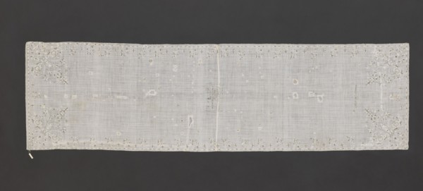 Church napkin. Napkin of white, thin, sparsely woven plain-weave batiste, embroidered with silk