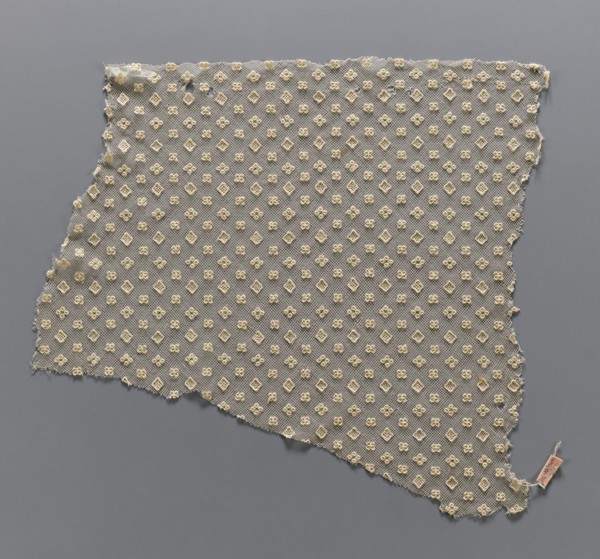 Lace fragment, lace, in a regular projective ornament with three motifs: a square, a quatrefoil,