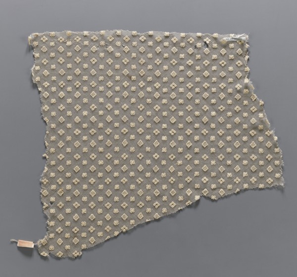 Lace fragment, in a regular projective ornament with three motifs: a square, a quatrefoil, and four