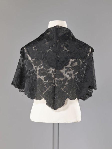 Cape, capes, fashion, women's clothing. Cape in the form of an elongated rhombus, made of black