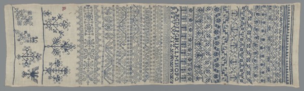 Embroidery sampler, Sampler with a cross-stitch pattern of trails, flower bushes, and letters. Blue