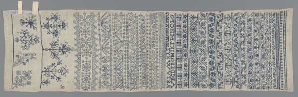 Embroidery sampler, Sampler with a cross-stitch pattern of trails, flower bushes, and letters. Blue