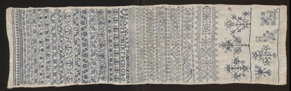 Embroidery sampler, Sampler with a cross-stitch pattern with motifs of trails, flower bushes, and