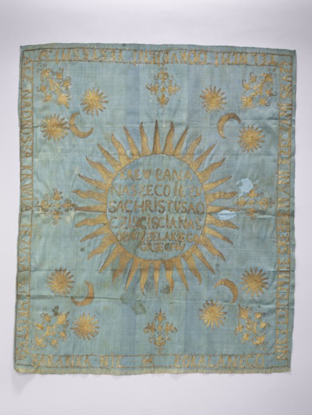 Church napkin. Blue silk rep cloth embroidered with gold thread. In the center, within a radiant
